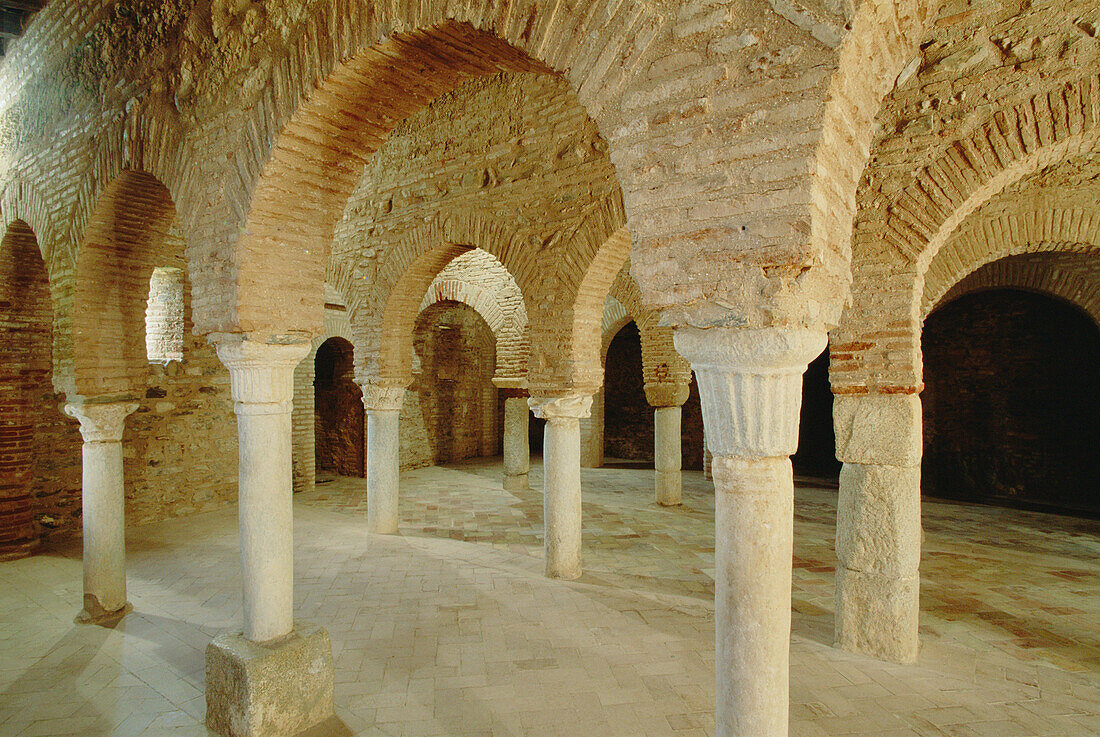 Brick horseshoe arches in the interior of 10th century mosque. Almonaster la Real. Huelva province, Andalusia, Spain