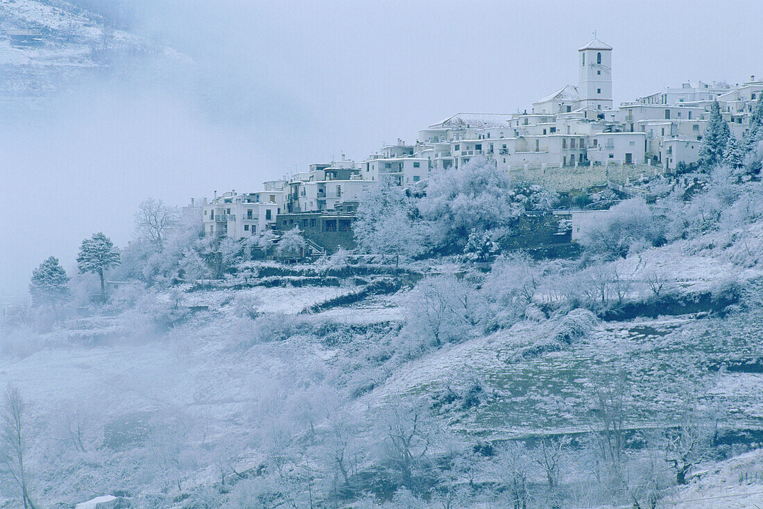 Capileira village in the high Alpujarras mountains area in winter after snowfall. Granada province, Andalusia, Spain