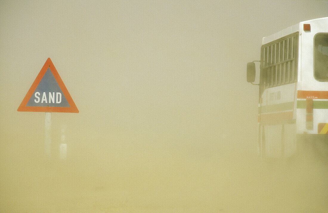 Sand road sign at the C 14 tarred road in the Namib Desert just outside the town of Walvis Bay. Namibia.