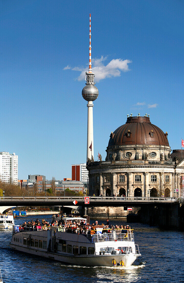 Excursion boat on river Spree, Bode Museum and television tower in background, Berlin, Germany