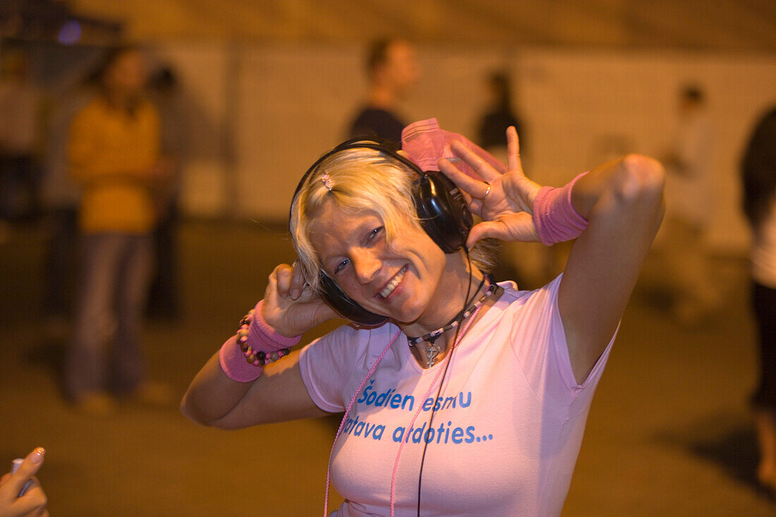 Girl enjoying the night on Liven square