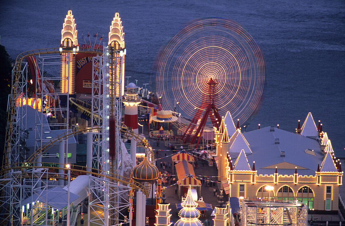 Amusement park in the evening light, Luna Park in North Sydney, Sydney, New South Wales, Australia