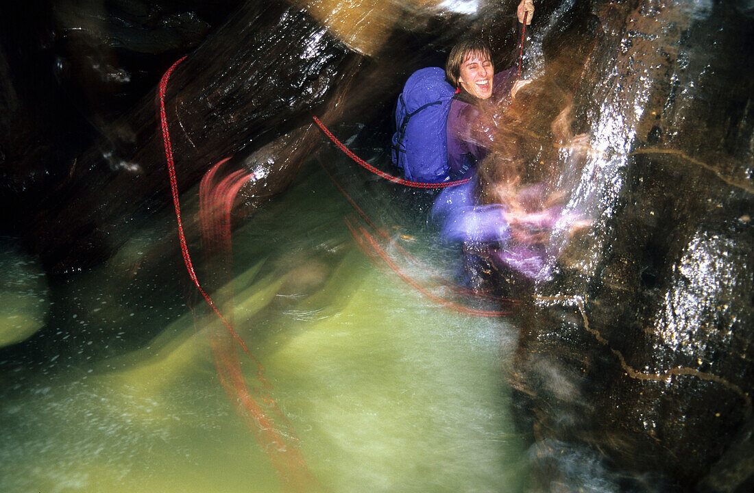 Two people canyoning in the Hole in the Wall Canyon, Blue Mountains National Park, New South Wales, Australia