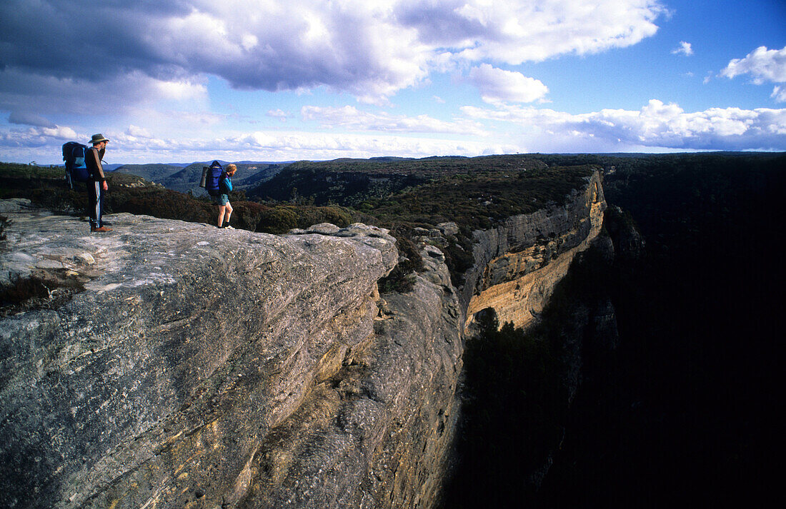 Two hikers on top of Kanangra Walls, Kanangra Boyd National Park, New South Wales, Australia