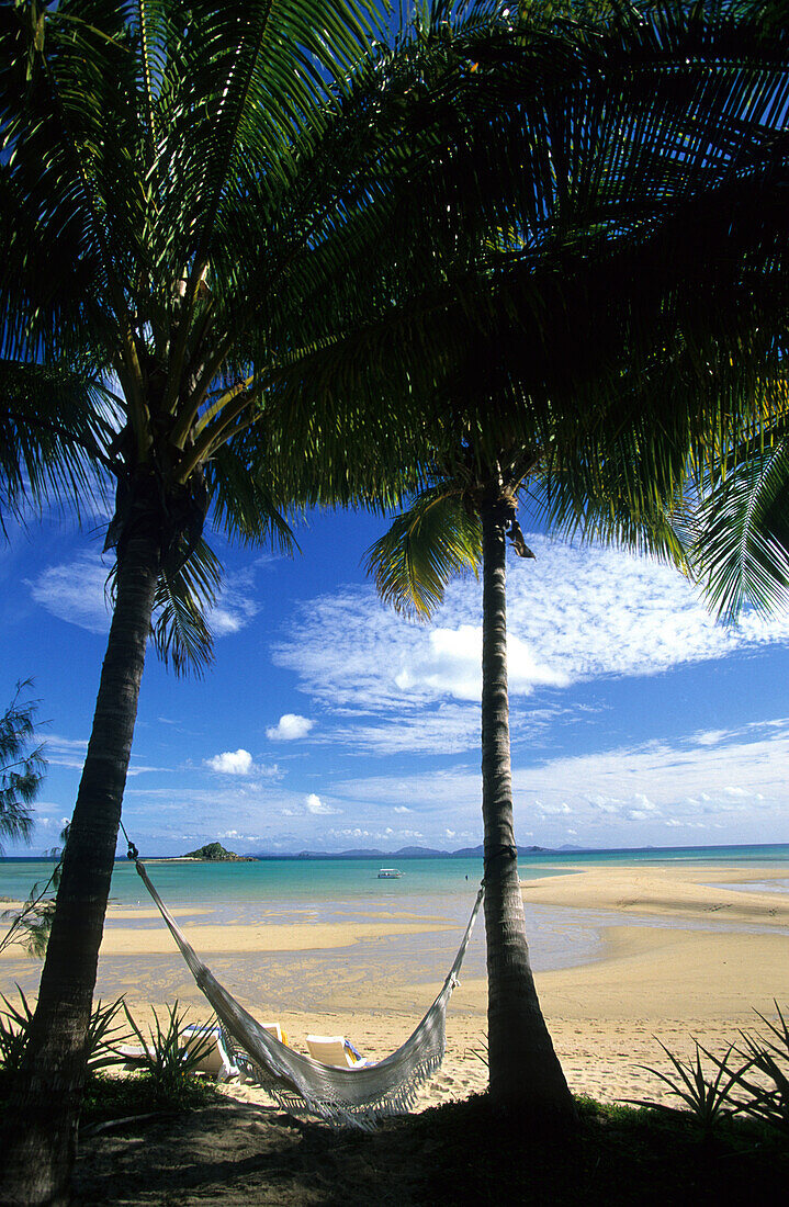 Hammock at the beach of Brampton Island Resort, Whitsunday Islands, Great Barrier Reef, Australia