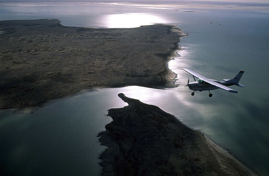 Flight over the partially filled salt lake Lake Eyre, South Australia, Australia