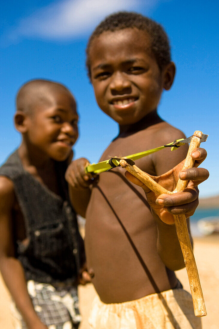 Two boys with a catapult, Madagascar, Africa