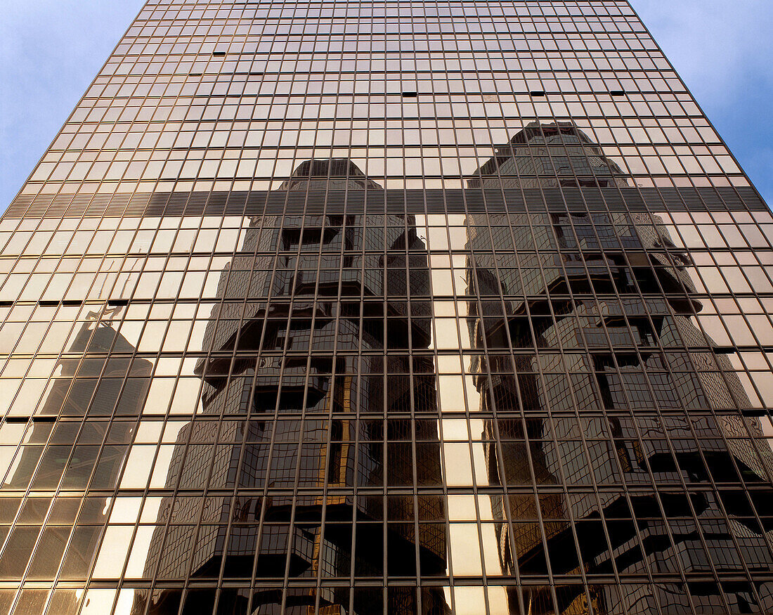 Bond Centre reflected on Bank of China facade. Hong Kong. China