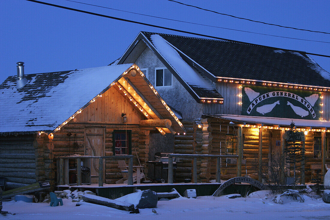 The Wapusk General Store at night in snow in the town of Churchill, Manitoba, Canada