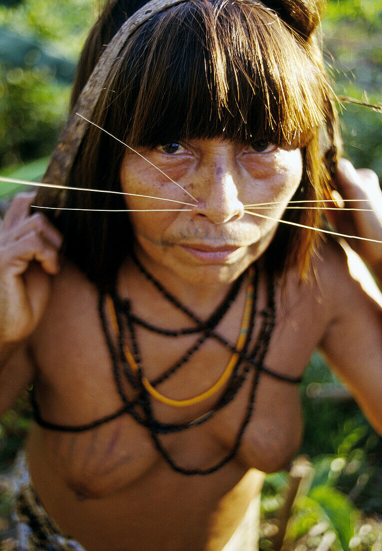 Mayoruna Indian woman, They are known as the cat people, San Jose de Añusi mayoruna Indian village. Galves River, tributary of the river Amazon. Peru