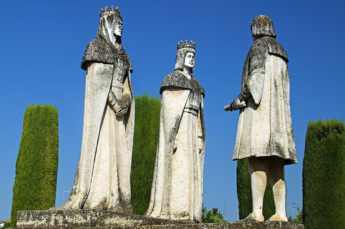 Statues of Queen Isabel, King Fernando and Christopher Columbus in Alcazar gardens. Cordoba. Andalusia, Spain