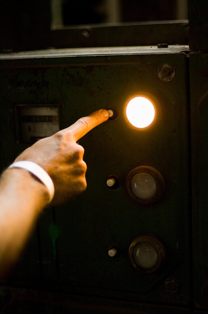 Man pushing button of an elevator