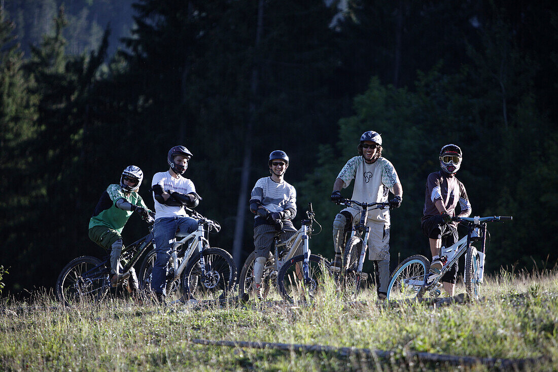Mountainbiker waiting on their bikes, Oberammergau, Bavaria, Germany
