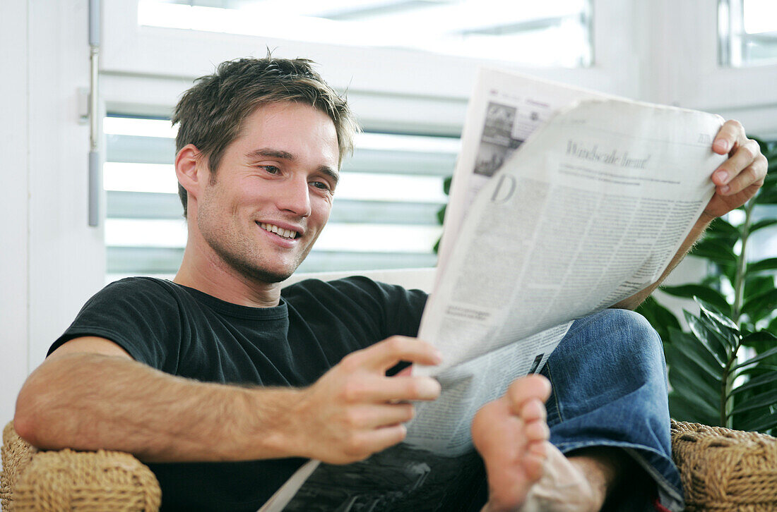 Young man smiling at camera, Munich, Germany