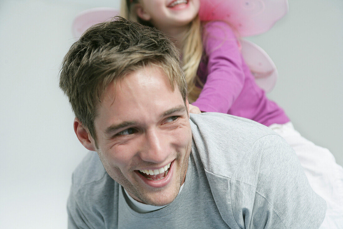 Father and daughter (3-4 years) playing, Munich, Germany