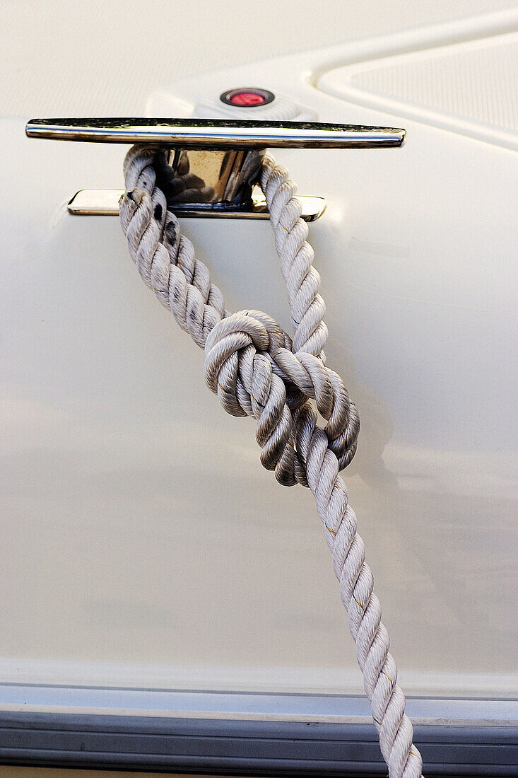  Anchor line, Boat, Boats, Cleat, Close up, Close-up, Closeup, Color, Colour, Concept, Concepts, Daytime, Detail, Details, Dock, Dock line, Docked, Exterior, Marina, Metal, Nylon, One, Outdoor, Outdoors, Outside, Rope, Ropes, Safety, Security, Stainless s