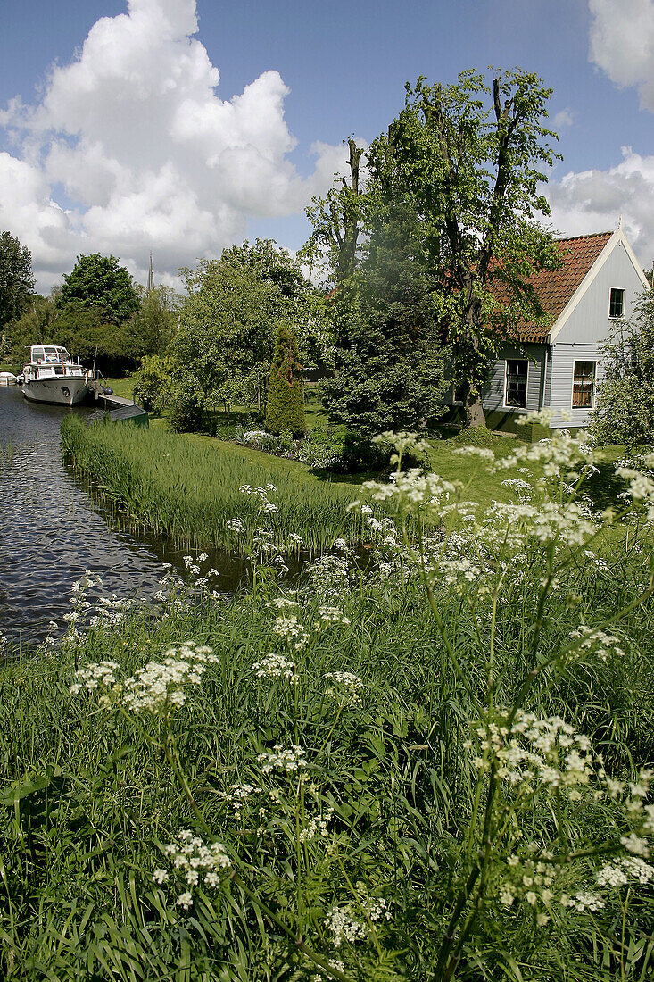 Scenic view of Dutch water landscape with houses. Monnikendam. Holland.