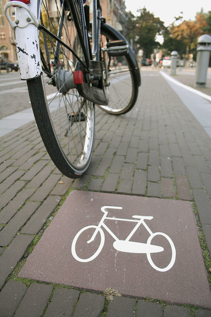 Bike sign on ground and bike, bike path, Amsterdam, Holland, Netherlands.