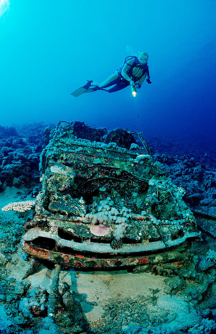 Scuba diver and Car wreck near Blue Belt shipwreck, Sudan, Africa, Red Sea