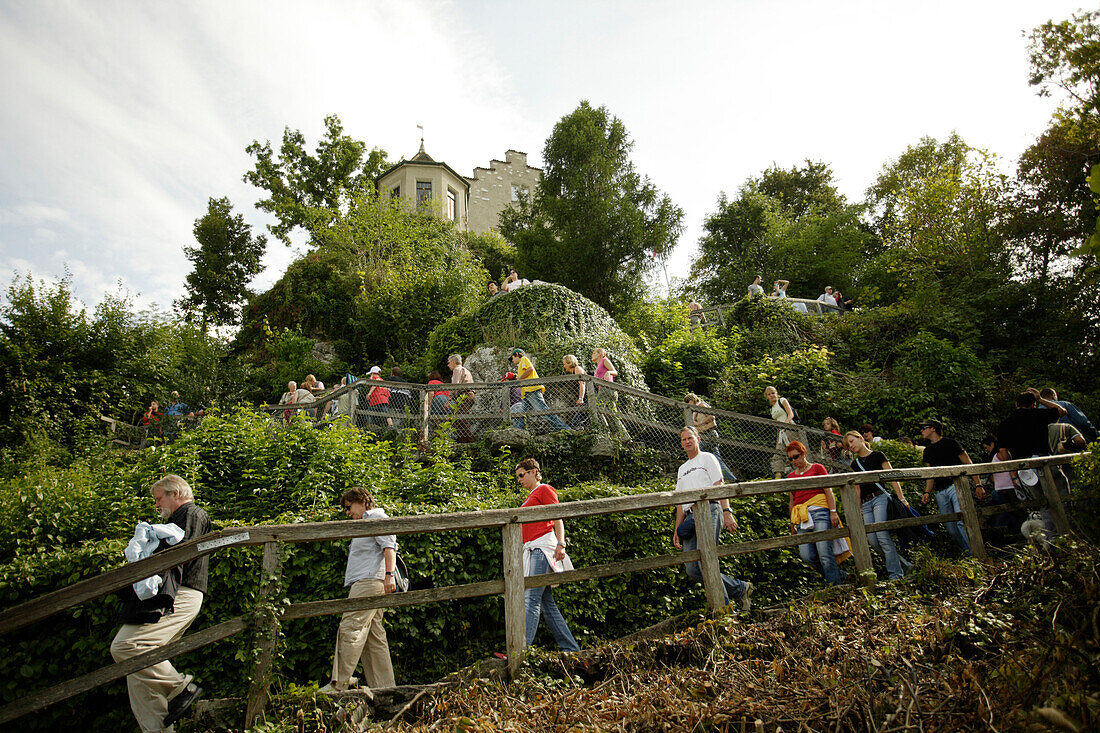 Tourists descending from Laufen Castle to the observation platform next to the Rhine Falls, Schaffhausen, Switzerland