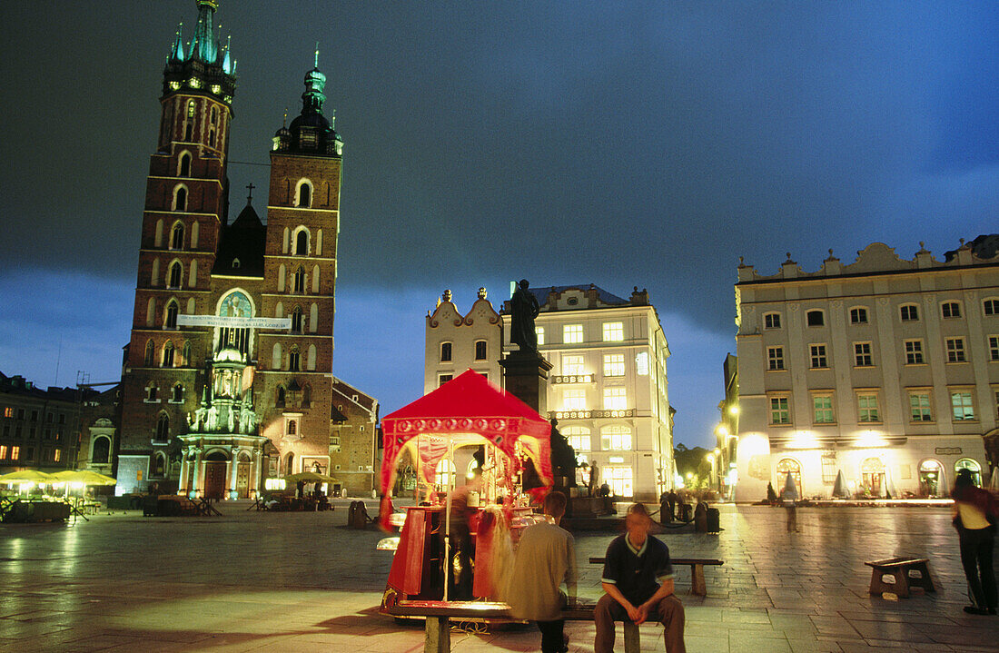 St Mary s Church and toy vendor s stall. Rynek Glowny. Krakow s town square. Poland