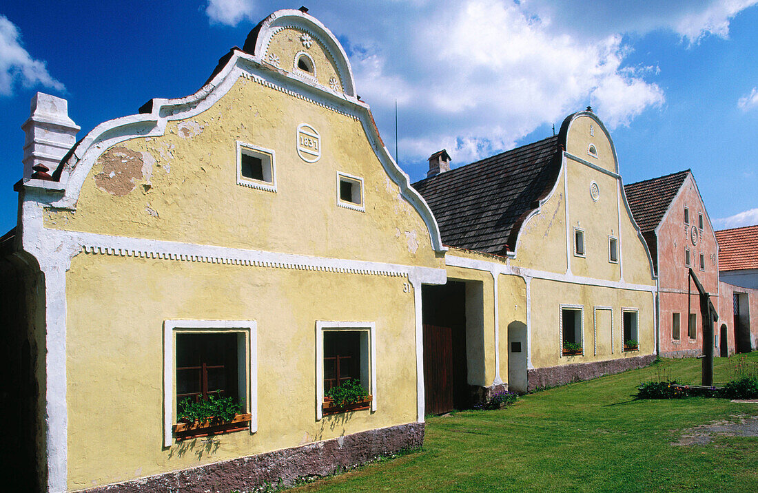 Barn and house details. Folk Baroque style (19th century). Holasovice. South Bohemia. Czech Republic