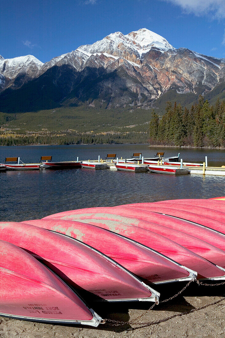 Rental boats at Pyramid Lake and Pyramid Mountain (2762 m) in background. Jasper National Park. Alberta, Canada