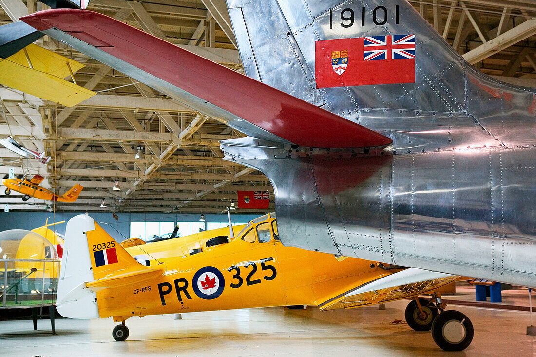 North American AT-6 Harvard WW2 trainer and Sabre Jet (1950 s). Alberta Aviation Museum. Edmonton. Alberta, Canada