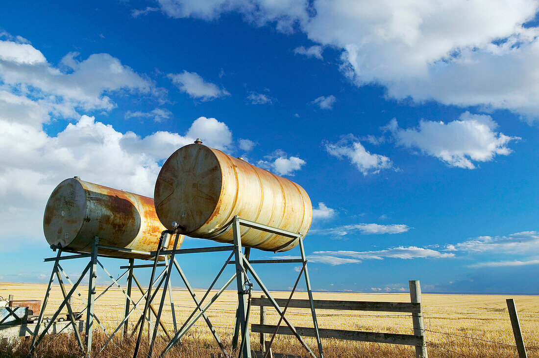 Oil tanks, landscape with dramatic sky. Stand Off. Alberta, Canada