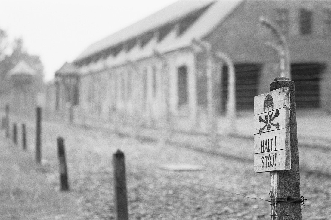Exterior view with sign, World War II Auschwitz concentration and extermination camp. Oswiecim. Poland