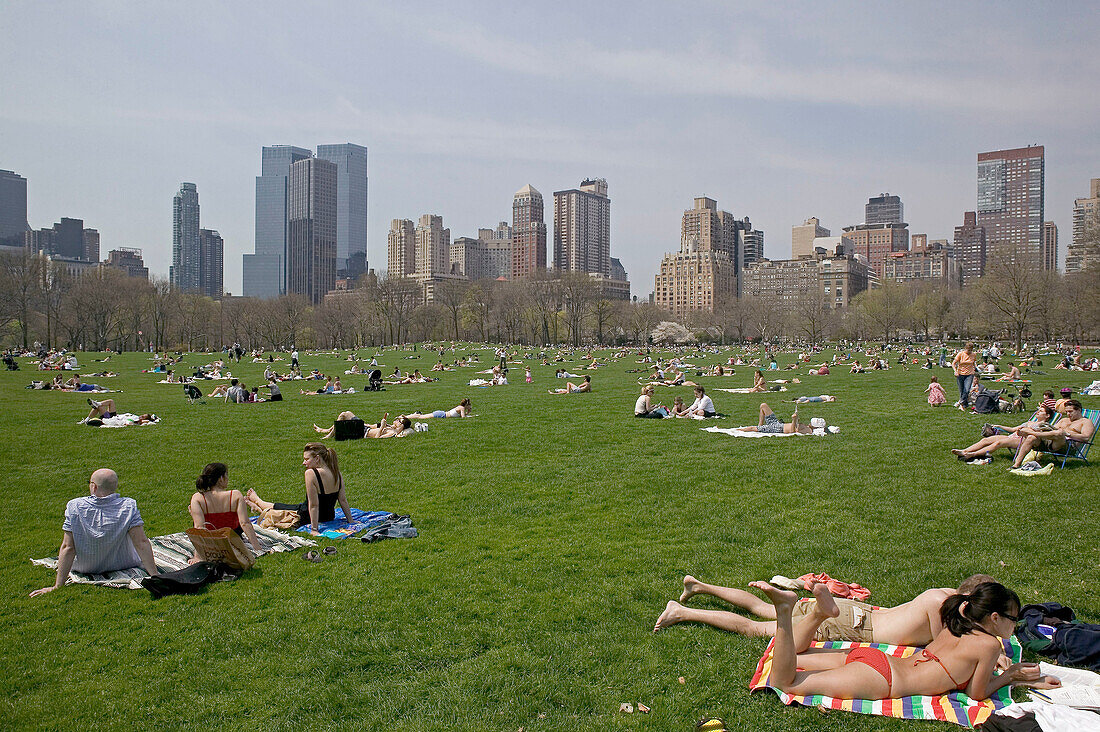 Springtime. Sunning on the Sheep Meadow. Central Park. Manhattan. New York city. USA.