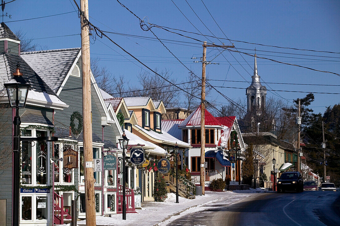 Town view with town church in winter. St. Sauveur des Monts. The Laurentians. Quebec. Canada.