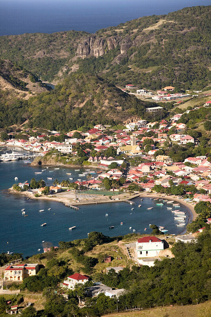 French West Indies (FWI), Guadeloupe, Les-Saintes Islands, Terre-de-Haut: Bourg Des Saintes. Town from Le Chameau Peak (309 meters) / Sunset