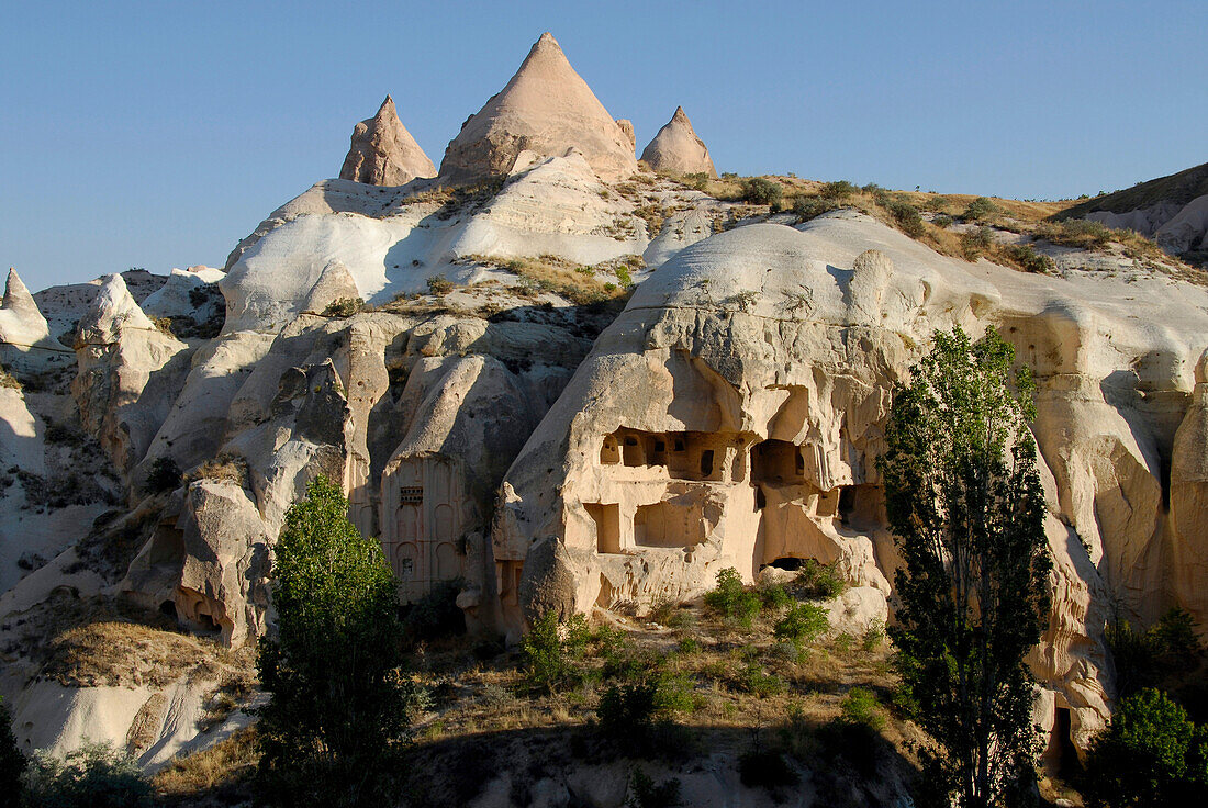 Rock houses, houses carved into the rocks, Mountain landscape, Cappadocia, Turkey, Europe