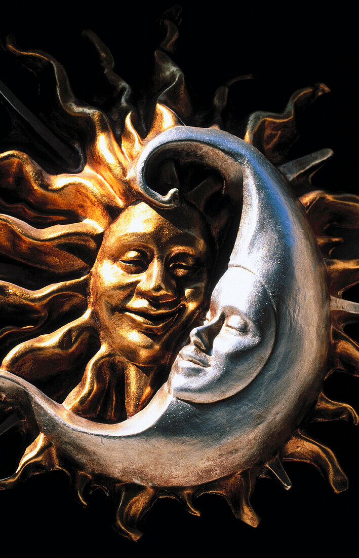 Carnival masks representing moon and sun. Venice. Italy