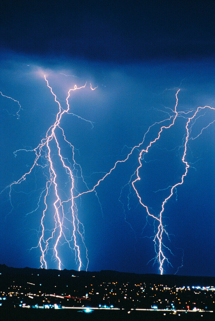Anger, Bolt, Bolts, Cities, City, Cloud, Clouds, Color, Colour, Danger, Electric power, Electricity, Energy, Exterior, Hazard, Light, Lightning, Meteorology, Natural phenomena, Natural phenomenon, Nature, Night, Nighttime, Outdoor, Outdoors, Outside, Powe