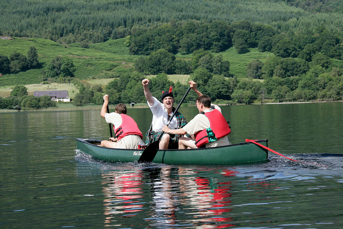 Three men in a canoe, Loch Ard, Southern Highlands, Scotland, Great Britain, Europe, mr