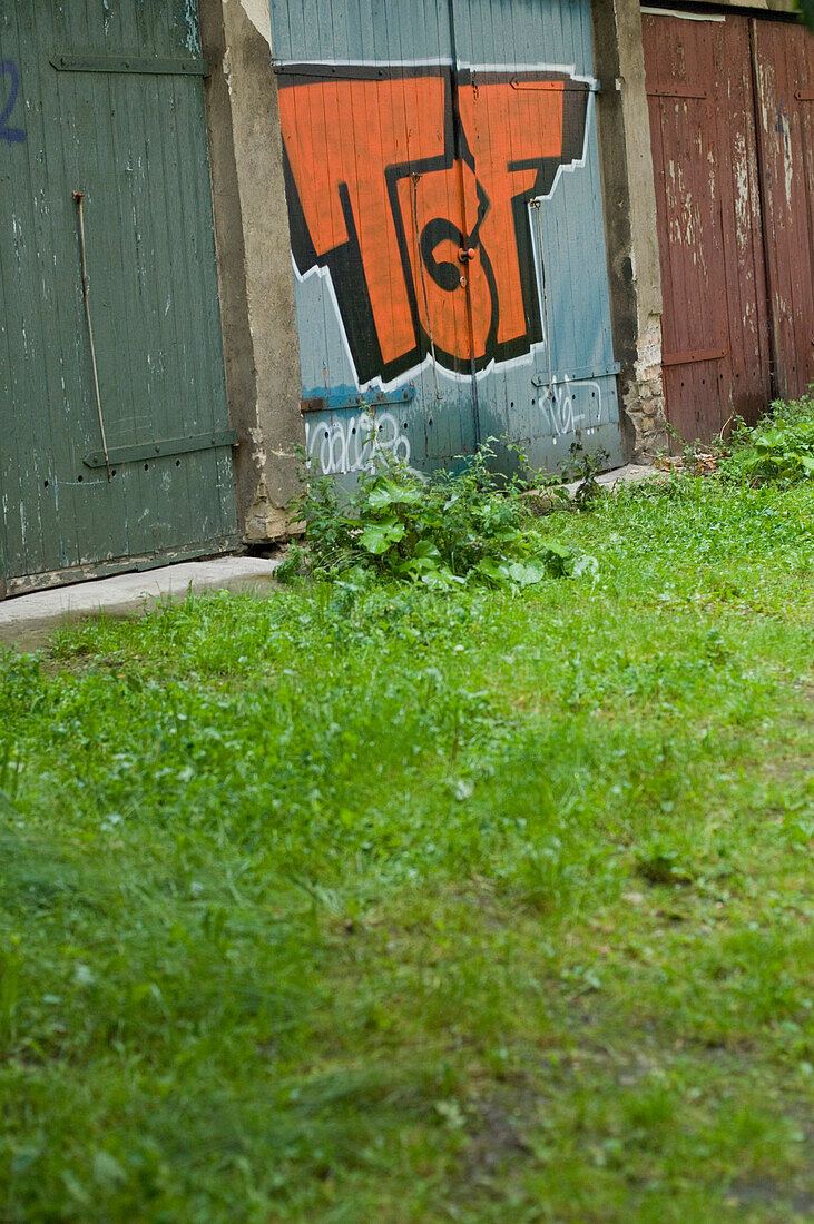 Graffiti on a gate, wall, Berlin, Germany