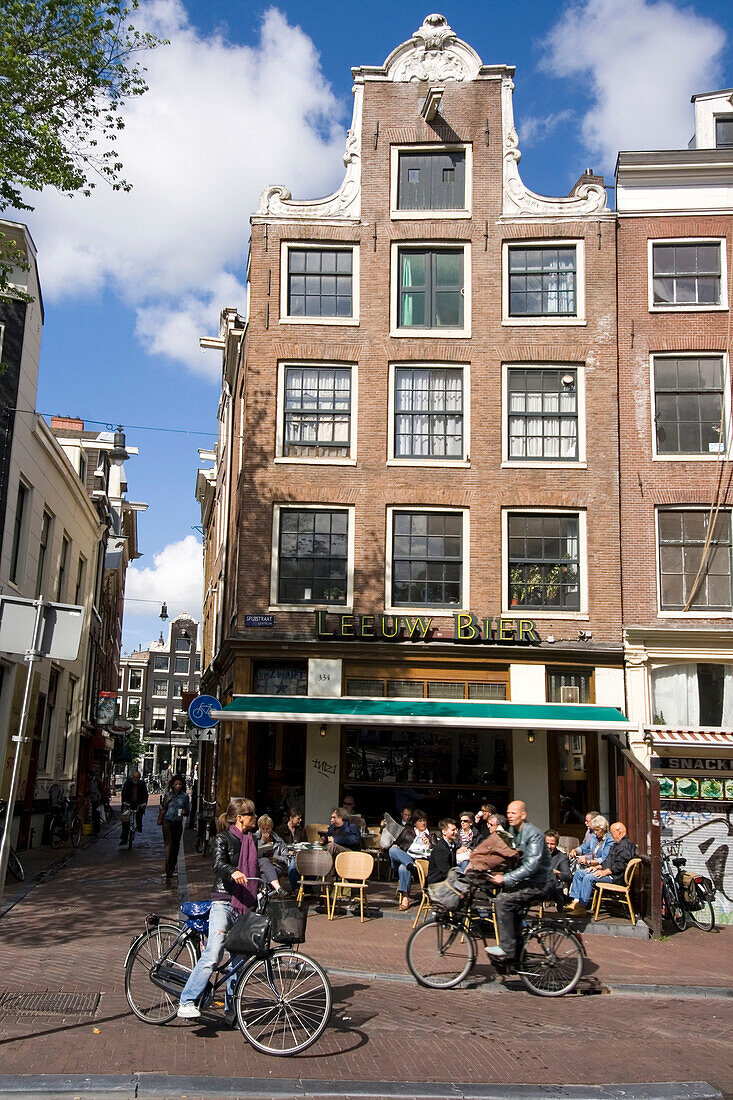 Amsterdam street cafe near Spui , bicycles