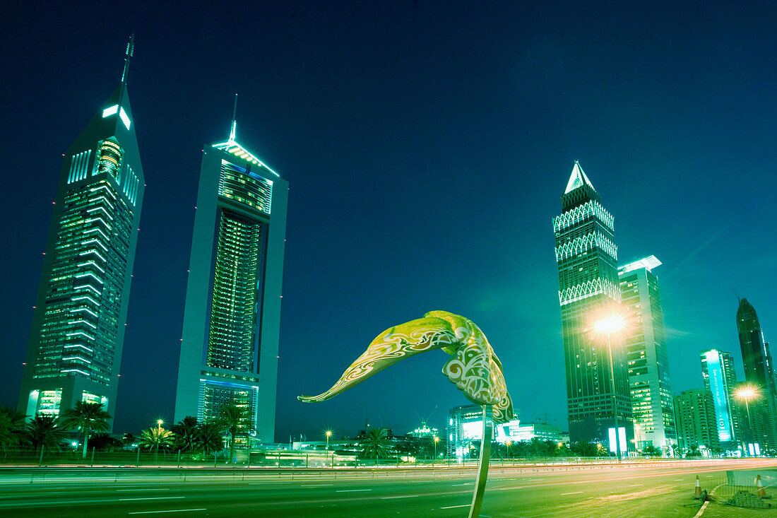 Dubai Sheikh Zayed Road skyscraper , Emirates towers, skyline , sculpture of a falcon