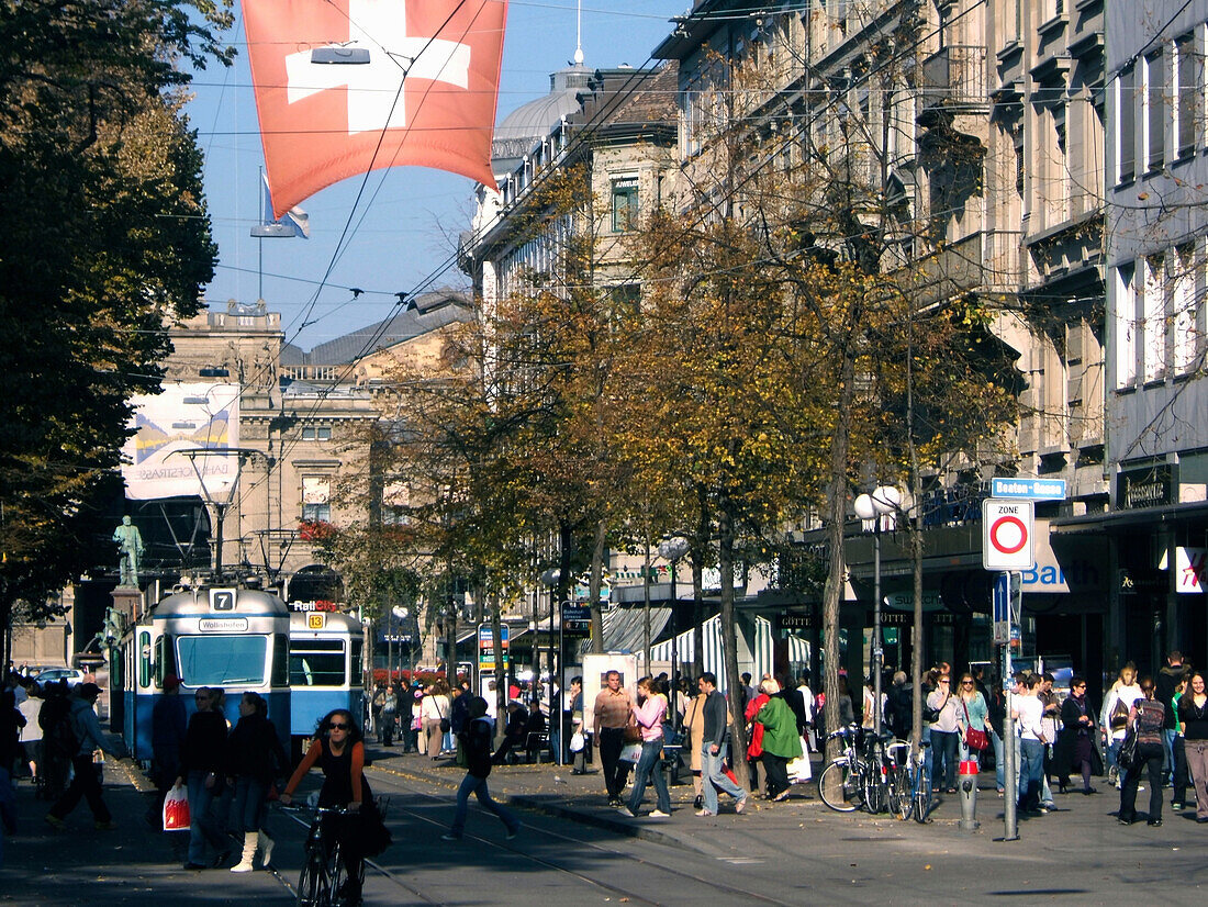 Switzerland,Zurich, Bahnhofstrasse,tram, swiss flag, people , spopping area