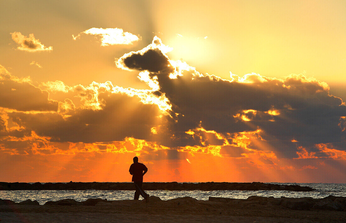 Jogger in sunset, Mediterranean, Tel Aviv, Israel