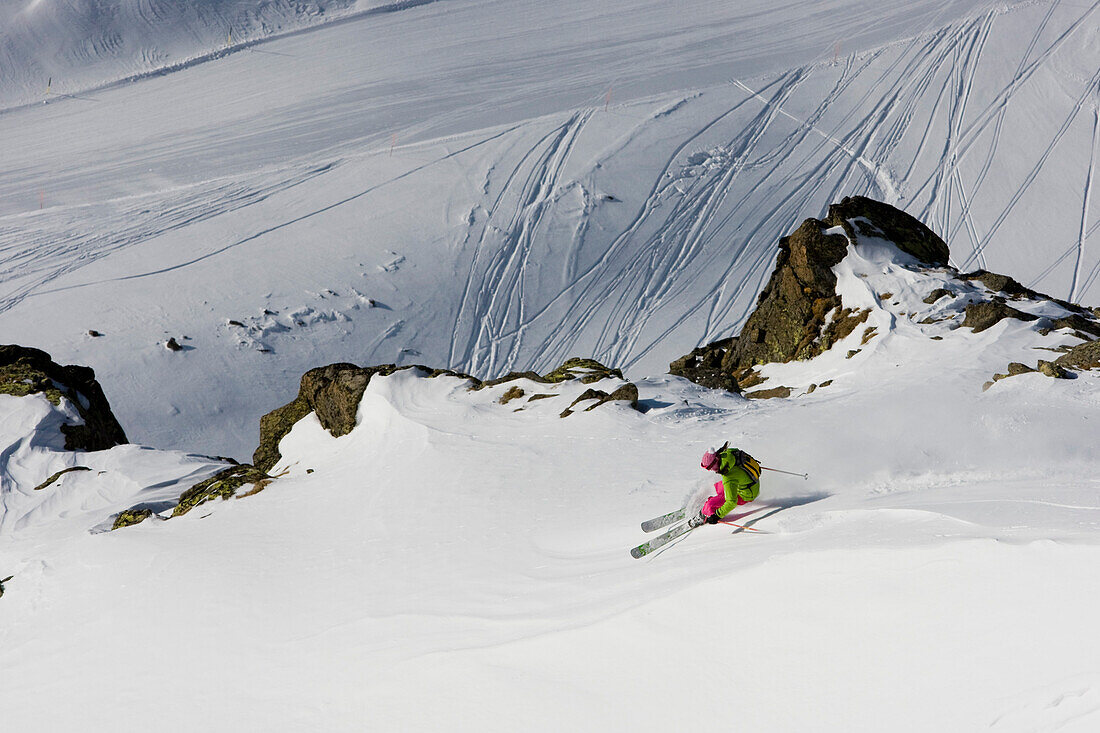 Female skier freeriding, Gemsstock skiing region, Andermatt, Canton Uri, Switzerland