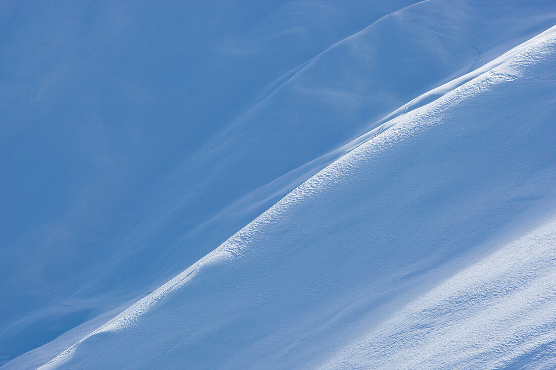 Sunlight and shade on snow surface, Disentis, Grisons, Switzerland