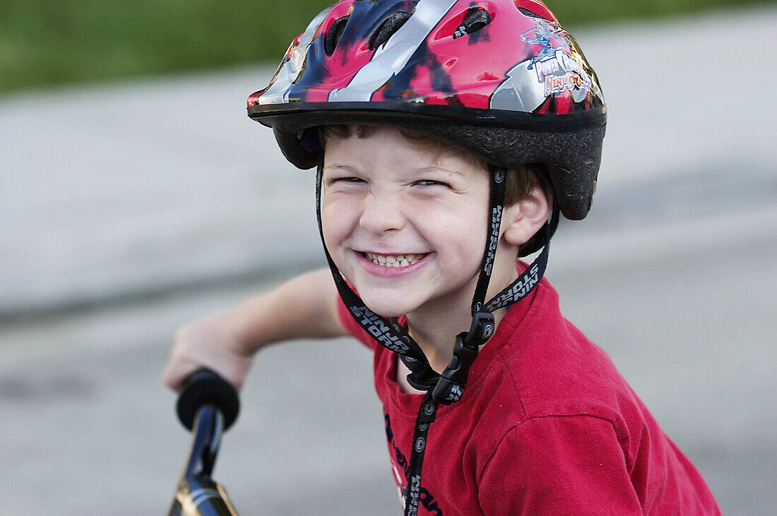 Smiling boy with bike helmet