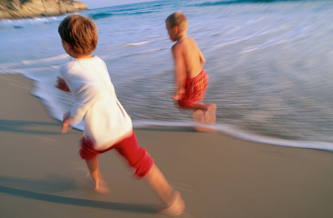 Friends running at the beach