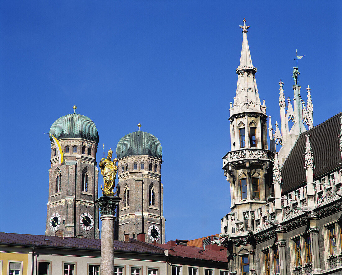 View from Marienplatz to the steeples of Frauenkirche with St Maries column and parts of the New city Hall on the right Munich Upper Bavaria Germany