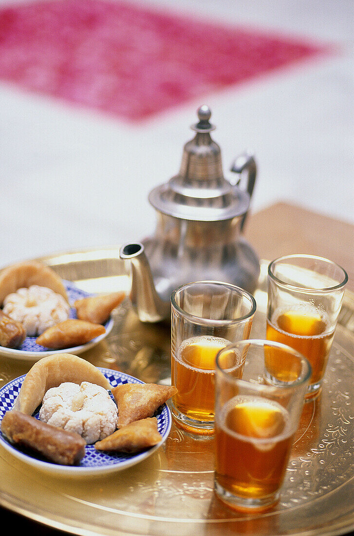 Tea time, roses on the ground. Ryad Cheriffa. Marrakech. Morocco.