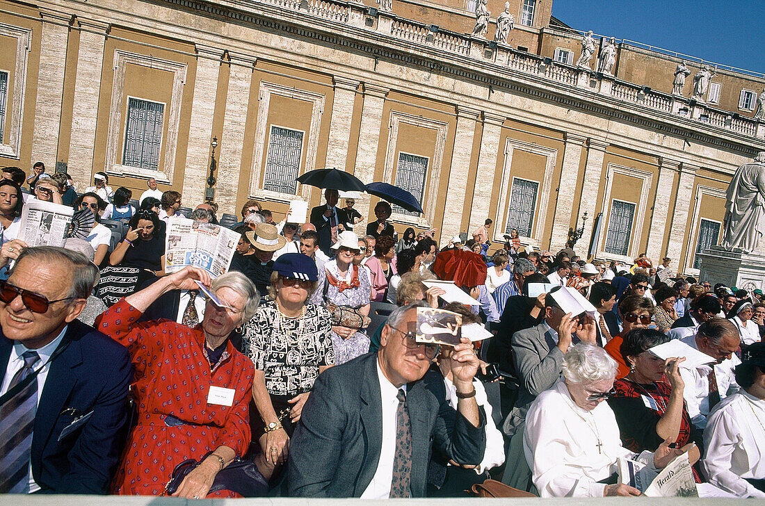 Attending a mass with the Pope under bright sun. St. Peter square. Vatican. Rome. Italy.