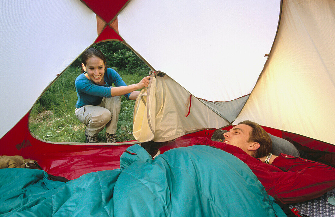 Young couple at camp. Eagle River Valley. Southcentral Alaska